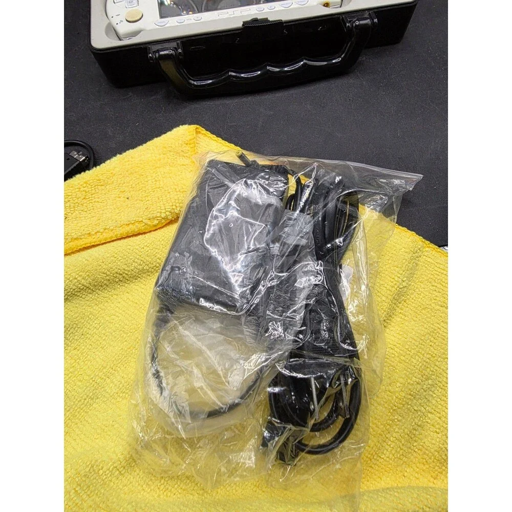 Sony PSP-2001 White Bundle – New Battery, 4 Games, Crash UMD Movie